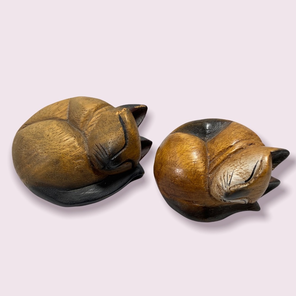 A pair of two Wooden Hand Carved Curled Up Sleeping Kitty Cat Figurines